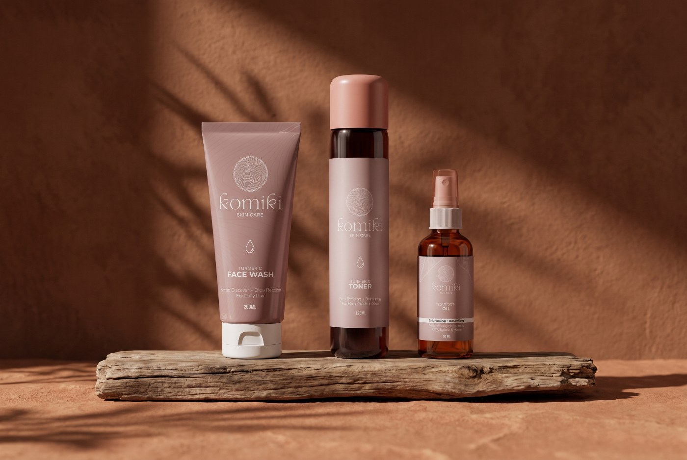 The three-piece Komiki everyday ritual — face wash, toner and carrot oil